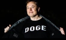 Elon Musk wearing a DOGE shirt