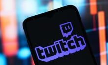The Twitch logo is seen displayed on a smartphone screen.