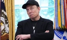 Elon Musk appears in the Oval Office wearing a Doge hat