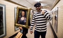 A couple in the Louvre heist Halloween costumes walk through the London Underground on October 31, 2025 in London, England. Halloween is widely celebrated across the UK with revellers dressing up for the occasion. Consumer spending on Halloween is forecast to rise 3.2% this year to about £537m.
