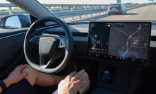 a tesla driver on the highway goes hands free in full self driving mode