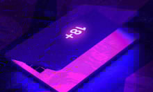 partly-closed laptop with an 18+ sticker on it