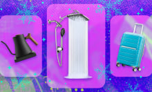 electric kettle, shower head, and luggage on abstract wintery background