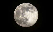 The full moon in the night sky.