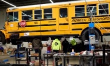 A diesel school bus is converted to an electric vehicle.