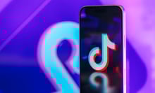 An image of the TikTok logo on a phone screen