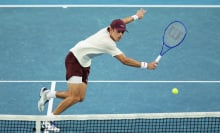 Alex de Minaur plays a backhand in the Australian Open