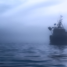 A ship amid the fog in the ocean