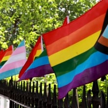 Pride flags on the fence at the Stonewall National Monument in Christopher Park, New York.