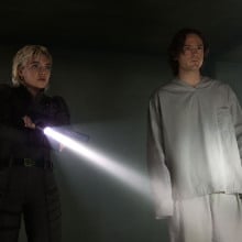 'Thunderbolts*' characters Yelena and Bob stand in a dark room. 