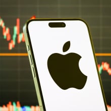 apple logo in front of a stock chart