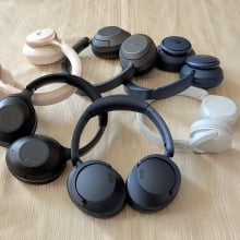 pairs of headphones piled up on each other