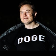 Elon Musk wearing a DOGE shirt