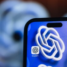 A phone home screen shows the ChatGPT app. It's background is the ChatGPT logo.