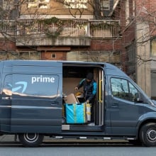 Amazon Prime Now Delivery van and driver delivering packages in new york city