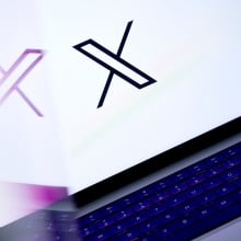 X logo on laptop