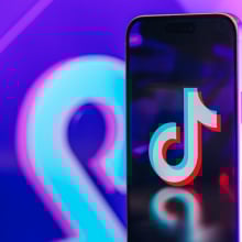 An image of the TikTok logo on a phone screen
