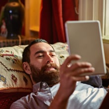 Man reading Kindle