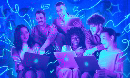 A group of people on their laptops, working together 