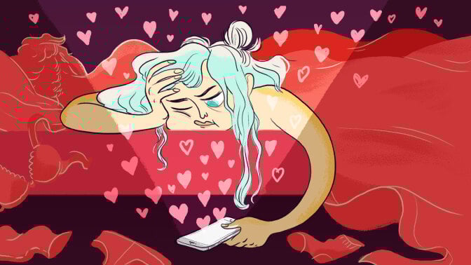 A woman next to a partner in bed looking at a dating app on her phone.