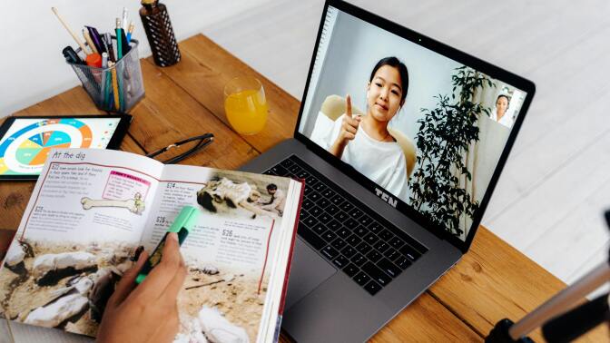 Notes and laptop on desk