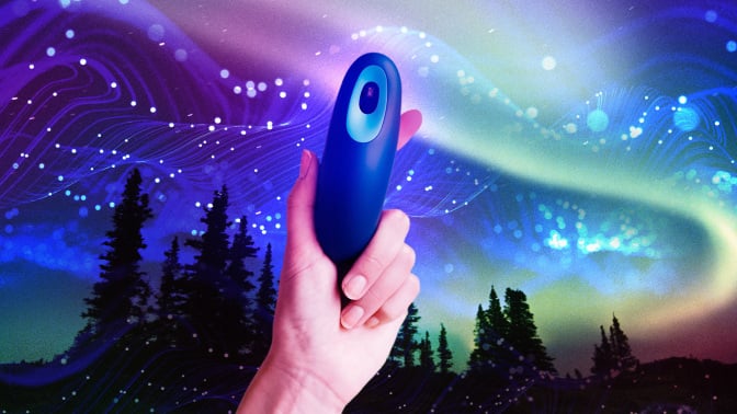 A person holding a Moonbird device against a starry sky.