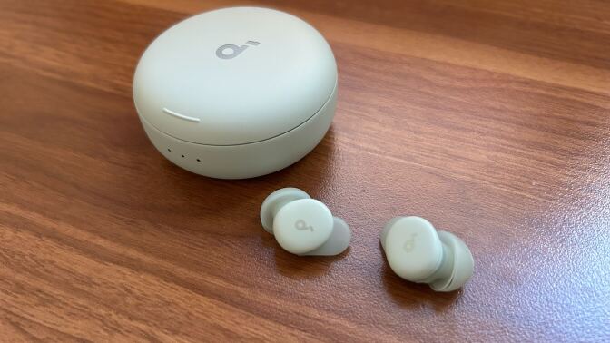 mint soundcore sleep earbuds on a desktop