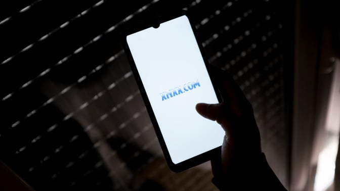 In this photo illustration a XNXX.COM logo seen displayed on a smartphone