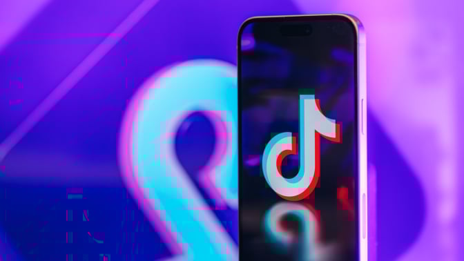 The TikTok logo on an iPhone screen