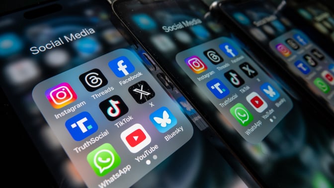  iPhone screens display various social media apps on the screens