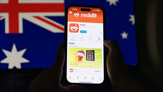 reddit on a phone with an australian flag in the background