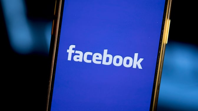 Facebook logo on smartphone screen