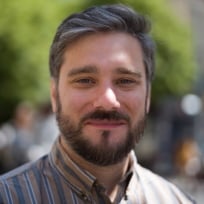 headshot of timothy beck werth, a handsome journalist with great hair