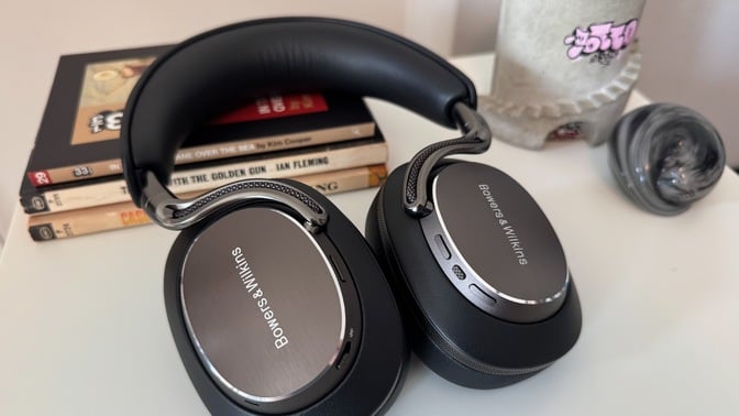 bowers and wilkins px8 s2 headphones on pile of books