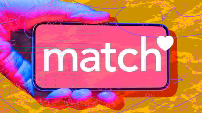 Hand holding phone with Match logo against abstract background