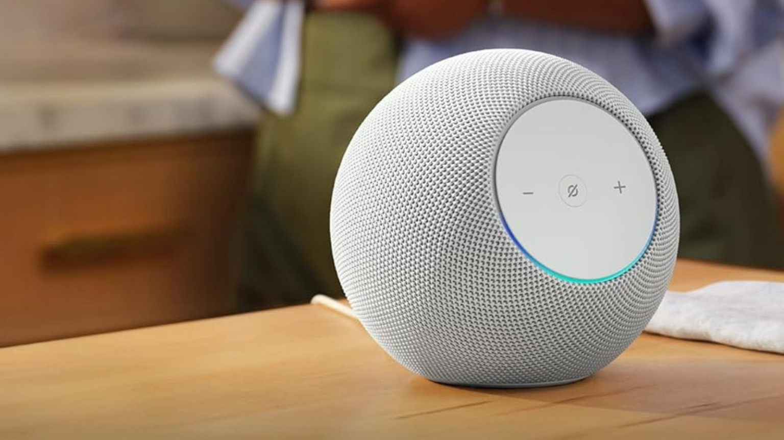 Amazon Echo Studio in glacier white on wood countertop