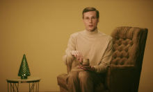 An awkward looking man poses as an AI chatbot that said harmful things to young users. 