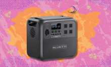 Bluetti AC180 Portable Power Station on orange and pink abstract background