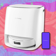 Narwal Freo Pro robot vacuum and mop on purple and orange abstract background