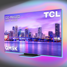 TCL QM9K TV arranged on gray backdrop with burst of color