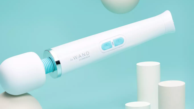 A Le Wand vibrator against a teal background. 