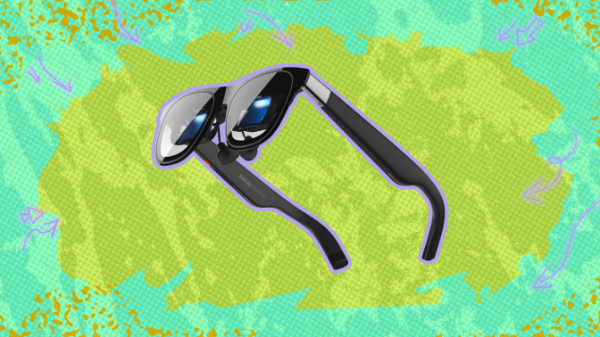 Xreal One Pro AR Glasses against a green background. 